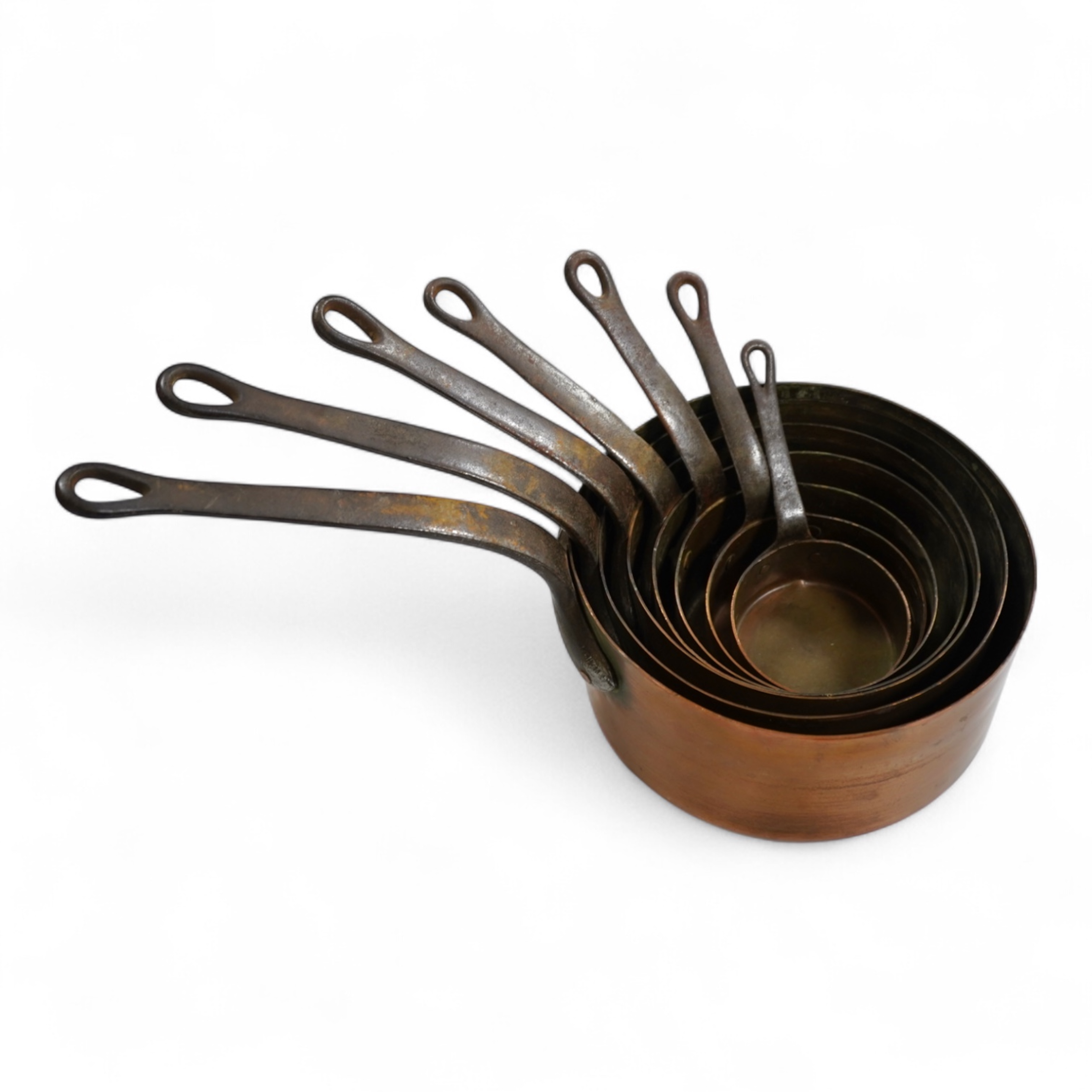 A graduated set of seven French copper pans